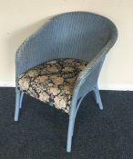 A blue Lloyd Loom chair. Est. £10 - £20.