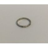 A three stone diamond half eternity ring in 18 car