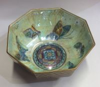 WEDGWOOD: A red Fairyland lustre bowl decorated wi