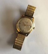 A gent's 9 carat Garrards' wristwatch with date ap