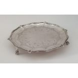 A Victorian silver waiter with beaded rim on ball