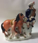 A tall Staffordshire figure of a Scotsman on horse