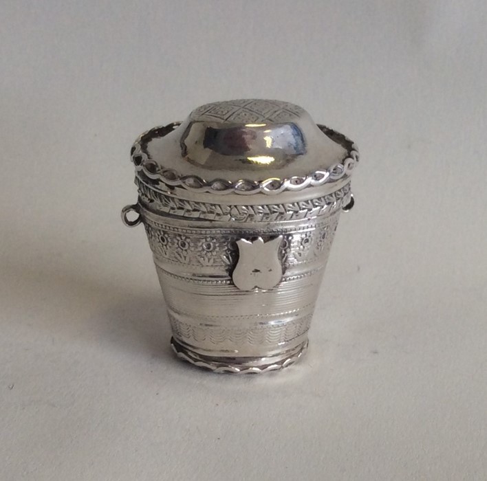 A Dutch tapering silver spice box with hinged top.