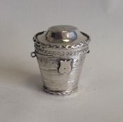 A Dutch tapering silver spice box with hinged top.