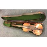 An old violin together with two bows in case. Est.