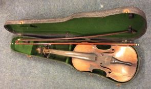 An old violin together with two bows in case. Est.