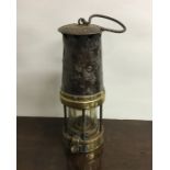 An Antique brass mounted miner's lamp. Est. £30 -