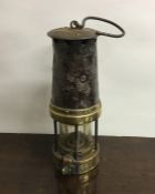 An Antique brass mounted miner's lamp. Est. £30 -