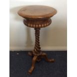 A Victorian burr walnut sewing table on twisted st