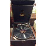 An old HMV record player. Est. £20 - £30.