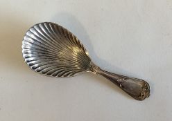 An Edwardian silver caddy spoon with shell bowl. S