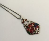 MERLE BENNETT: A stylish silver pendant decorated