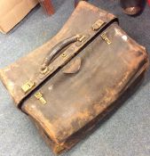 An old leather Gladstone bag etc. Est. £20 - £30.