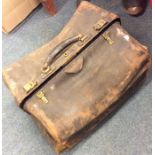 An old leather Gladstone bag etc. Est. £20 - £30.