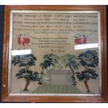 A large maple framed sampler decorated in bright f