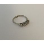 A diamond five stone half hoop ring in platinum cl