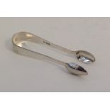 A pair of George III OE pattern silver tongs. Lond