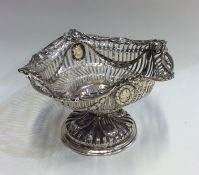 A Victorian silver bonbon dish decorated with flow