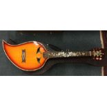 An unusual leaf shaped guitar with oak leaf MOP in