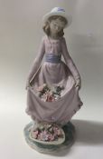 A Lladro figure of a girl curtsying. Est. £20 - £3