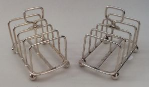 A good pair of Edwardian silver toast racks on bal
