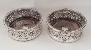 A good pair of Victorian silver wine coasters with