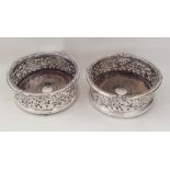 A good pair of Victorian silver wine coasters with
