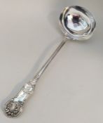 A heavy silver Queens' pattern soup ladle with cre