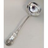 A heavy silver Queens' pattern soup ladle with cre