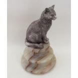 An unusual figure of a cat in seated position with