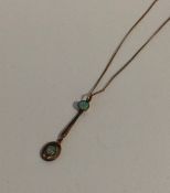 A 9 carat opal tow stone pendant on fine link chai