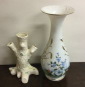 A Belleek three finger spill vase together with a