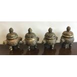 A set of four heavy Chinese brass censuses decorat