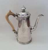 A good quality tapering silver coffee pot on reede