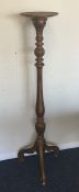 A gilt torchère on spreading supports. Est. £40 -
