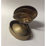 A set of tapering brass scallop shaped boxes with