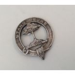 A circular Scottish silver brooch inscribed, 'Stan