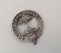 A circular Scottish silver brooch inscribed, 'Stan