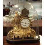 A French spelter mantle clock contained within a g