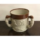 A Doulton Lambeth three handled loving cup of typi