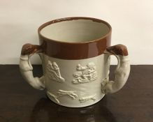A Doulton Lambeth three handled loving cup of typi