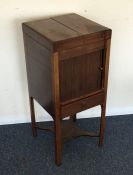 A Georgian hinged top wash stand with tambour fron