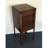 A Georgian hinged top wash stand with tambour fron