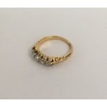 An 18 carat gold diamond five stone half hoop ring