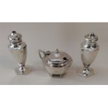 An Edwardian silver three piece cruet. Birmingham.