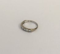 An 18 carat white gold eight stone diamond ring. A