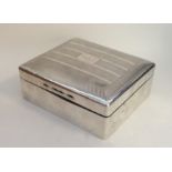 A silver dome top cigarette box with fitted interi