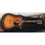 A cased guitar. By Egmond. Est. £30 - £50.