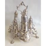 A rare George II Warwick cruet with scroll decorat