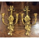 A pair of gilt wall sconces. Est. £20 - £30.